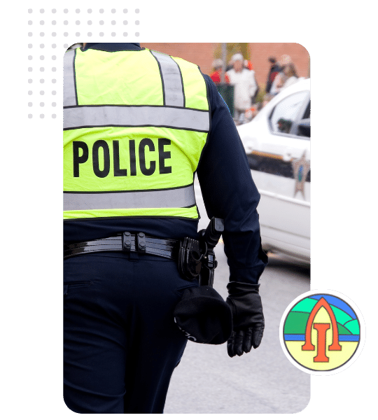 an image of the back of a Community Police officer with Askam and Ireleth Parish Council Logo in the bottom right of the image