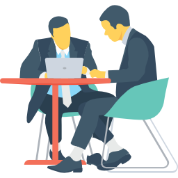 Meeting Minutes. 2 people at a desk.