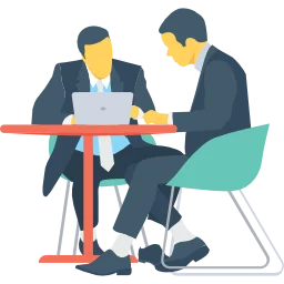 Meeting Minutes. 2 people at a desk.